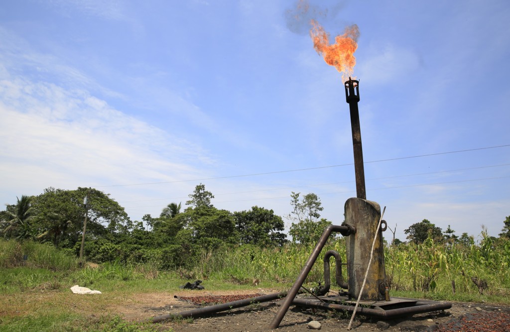 A flare spits flame into the sky near an oil field in the Ecuadorean Amazon. [Photo: Frederick Bernas]